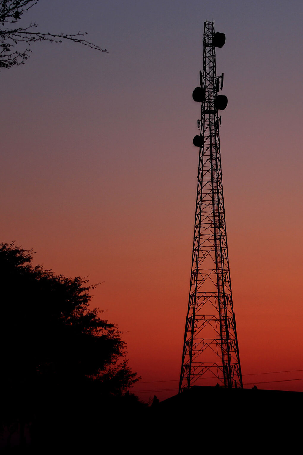 A telecommunications mast is pictured at sunset in Zambia. Chinese telecommunications firms are building Zambia’s telecommunications infrastructure.